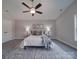 Bright bedroom featuring a ceiling fan, plush bedding, and ample natural light at 1016 Forest Dr, Marshville, NC 28103