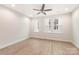 Spacious bedroom with hardwood floors and ceiling fan at 1407 Collier Walk Aly # Csw0103, Charlotte, NC 28205