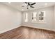 Spacious bedroom featuring hardwood floors and a ceiling fan at 1409 Collier Walk Aly # Csw0104, Charlotte, NC 28205