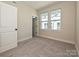 Bright bedroom with neutral walls and carpet, offering natural light at 1215 E 34Th St # Csw0315, Charlotte, NC 28205