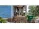 Small front porch with wooden floor and railing, needs some repairs at 118 Summit Ave, Albemarle, NC 28001