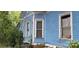 Blue house exterior with several windows, showing signs of age and needs some repairs at 118 Summit Ave, Albemarle, NC 28001