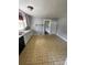 Quaint kitchen features classic tile floors and a view into the hallway at 3130 Faith Rd, Salisbury, NC 28146