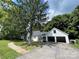 Charming single-story home with attached garage and well-maintained lawn at 3130 Faith Rd, Salisbury, NC 28146
