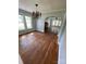 Bright dining room with hardwood floors and a chandelier, open to living room at 3130 Faith Rd, Salisbury, NC 28146