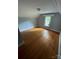 Bright bedroom with hardwood floors and a window at 3130 Faith Rd, Salisbury, NC 28146