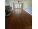 Spacious living room with hardwood floors and a stone fireplace at 3130 Faith Rd, Salisbury, NC 28146