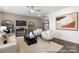 Modern living room boasts an accent wall, sleek furnishings, and natural light at 903 Woodington Ln # 78, Charlotte, NC 28214