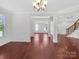Bright dining room with hardwood floors and elegant chandelier at 509 Pine Needle Ct, Weddington, NC 28104