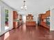 Modern kitchen with island, stainless steel appliances, and wood cabinets at 509 Pine Needle Ct, Weddington, NC 28104