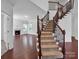 Impressive staircase with wrought iron railing and hardwood steps at 509 Pine Needle Ct, Weddington, NC 28104