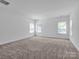 Large bedroom with neutral carpeting and natural light at 509 Pine Needle Ct, Weddington, NC 28104