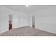 Spacious bedroom with carpet, double doors, and private bath at 509 Pine Needle Ct, Weddington, NC 28104