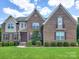 Two-story brick home with landscaping and shutters at 509 Pine Needle Ct, Weddington, NC 28104
