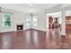 Cozy living room with hardwood floors and a fireplace at 509 Pine Needle Ct, Weddington, NC 28104