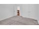 Bedroom with carpet flooring and access to loft area at 509 Pine Needle Ct, Weddington, NC 28104