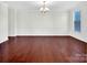 Elegant dining room boasts hardwood floors and wainscoting at 509 Pine Needle Ct, Weddington, NC 28104