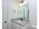 Bathroom with granite countertop, white vanity, and black fixtures at 271 Malvern Dr, Concord, NC 28025