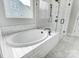 Bathroom featuring a large soaking tub at 2003 Cedar Falls Dr # 69, Waxhaw, NC 28173