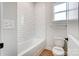 Clean bathroom with white subway tile and tub at 2003 Cedar Falls Dr # 69, Waxhaw, NC 28173