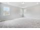 Bright bedroom with three windows and carpeting at 2003 Cedar Falls Dr # 69, Waxhaw, NC 28173