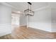 Formal dining room with hardwood floors and elegant lighting fixture at 2003 Cedar Falls Dr # 69, Waxhaw, NC 28173