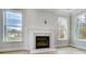 Modern fireplace with marble surround and large windows at 2003 Cedar Falls Dr # 69, Waxhaw, NC 28173