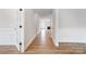 Bright hallway with hardwood floors and white wainscoting at 2003 Cedar Falls Dr # 69, Waxhaw, NC 28173