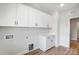 Laundry room with white cabinets and wood flooring at 2003 Cedar Falls Dr # 69, Waxhaw, NC 28173