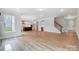Large living area with hardwood floors and kitchen views at 2003 Cedar Falls Dr # 69, Waxhaw, NC 28173
