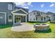 Backyard with fire pit, patio, and view of neighboring house at 2004 Cedar Falls Dr # 4, Waxhaw, NC 28173