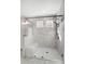 Large walk-in shower with marble tile, built-in seat, and frameless glass door at 2004 Cedar Falls Dr # 4, Waxhaw, NC 28173