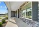 Covered front porch with stone and gray siding exterior at 2004 Cedar Falls Dr # 4, Waxhaw, NC 28173