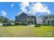 House with backyard, grassy lawn, and fire pit at 2004 Cedar Falls Dr # 4, Waxhaw, NC 28173