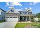 Two story house with gray siding and stone accents at 2004 Cedar Falls Dr # 4, Waxhaw, NC 28173
