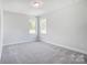 Spacious bedroom with neutral walls and grey carpeting at 2004 Cedar Falls Dr # 4, Waxhaw, NC 28173