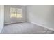 Spacious bedroom with neutral wall paint and grey carpet at 2004 Cedar Falls Dr # 4, Waxhaw, NC 28173