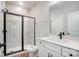 Clean bathroom with a white vanity, marble shower, and a toilet at 2004 Cedar Falls Dr # 4, Waxhaw, NC 28173