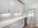Built-in wine cooler and white cabinets in this kitchen at 2004 Cedar Falls Dr # 4, Waxhaw, NC 28173