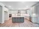 Modern kitchen with white cabinets and large island at 2004 Cedar Falls Dr # 4, Waxhaw, NC 28173