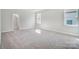 Well-lit bedroom featuring grey carpet and a walk-in closet at 2004 Cedar Falls Dr # 4, Waxhaw, NC 28173