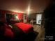 Main bedroom with king bed, and access to additional rooms at 6401 N Matson St, Kershaw, SC 29067