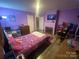 Bedroom with full-size bed and fireplace at 6401 N Matson St, Kershaw, SC 29067