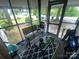 Relaxing screened porch with seating, perfect for enjoying the outdoors at 6401 N Matson St, Kershaw, SC 29067