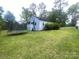 Back of house with trampoline and yard at 6401 N Matson St, Kershaw, SC 29067