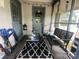 Screened porch with seating and rug at 6401 N Matson St, Kershaw, SC 29067