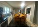 Kitchen boasts white cabinets, granite counters, and a dining area at 6401 N Matson St, Kershaw, SC 29067