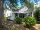 White house with screened porch and yard at 6401 N Matson St, Kershaw, SC 29067