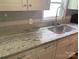 Kitchen boasts granite countertops and modern white cabinets at 7067 Citation St, York, SC 29745