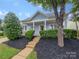 Charming house with a landscaped yard and front porch at 24589 Blue Heron Cir, Lancaster, SC 29720